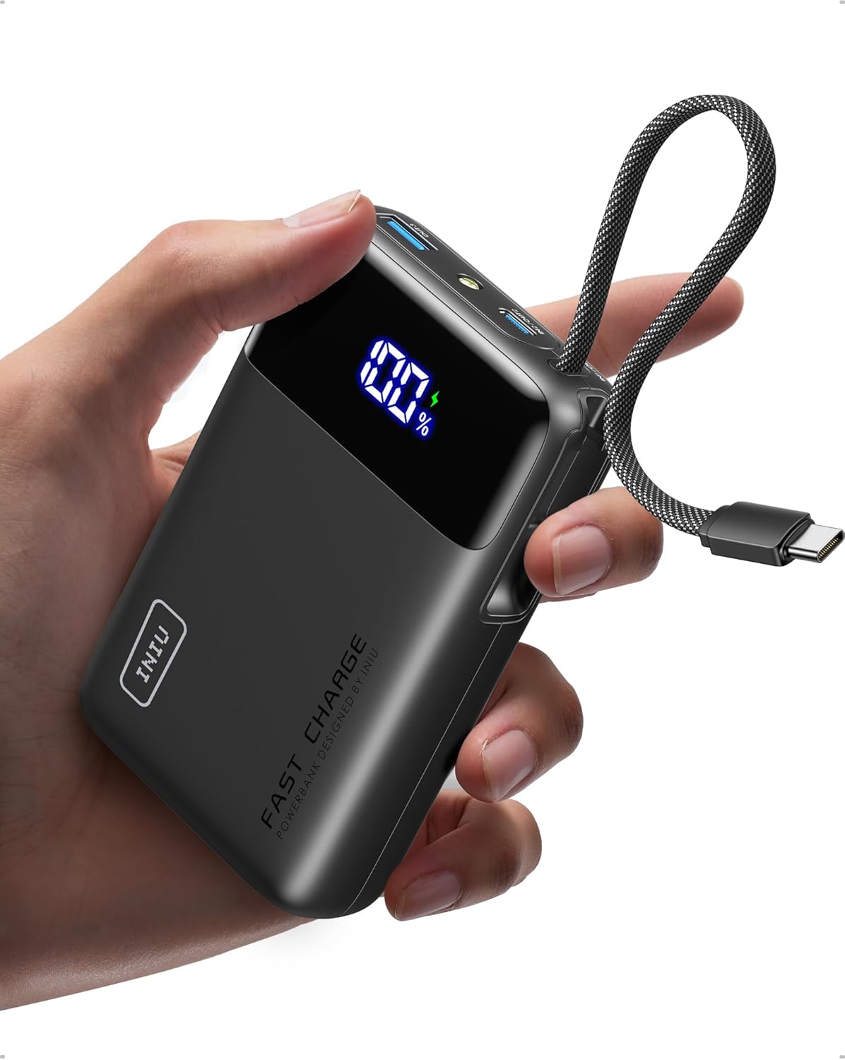 INIU Mini power bank held in a hand showing its pocket-size footprint