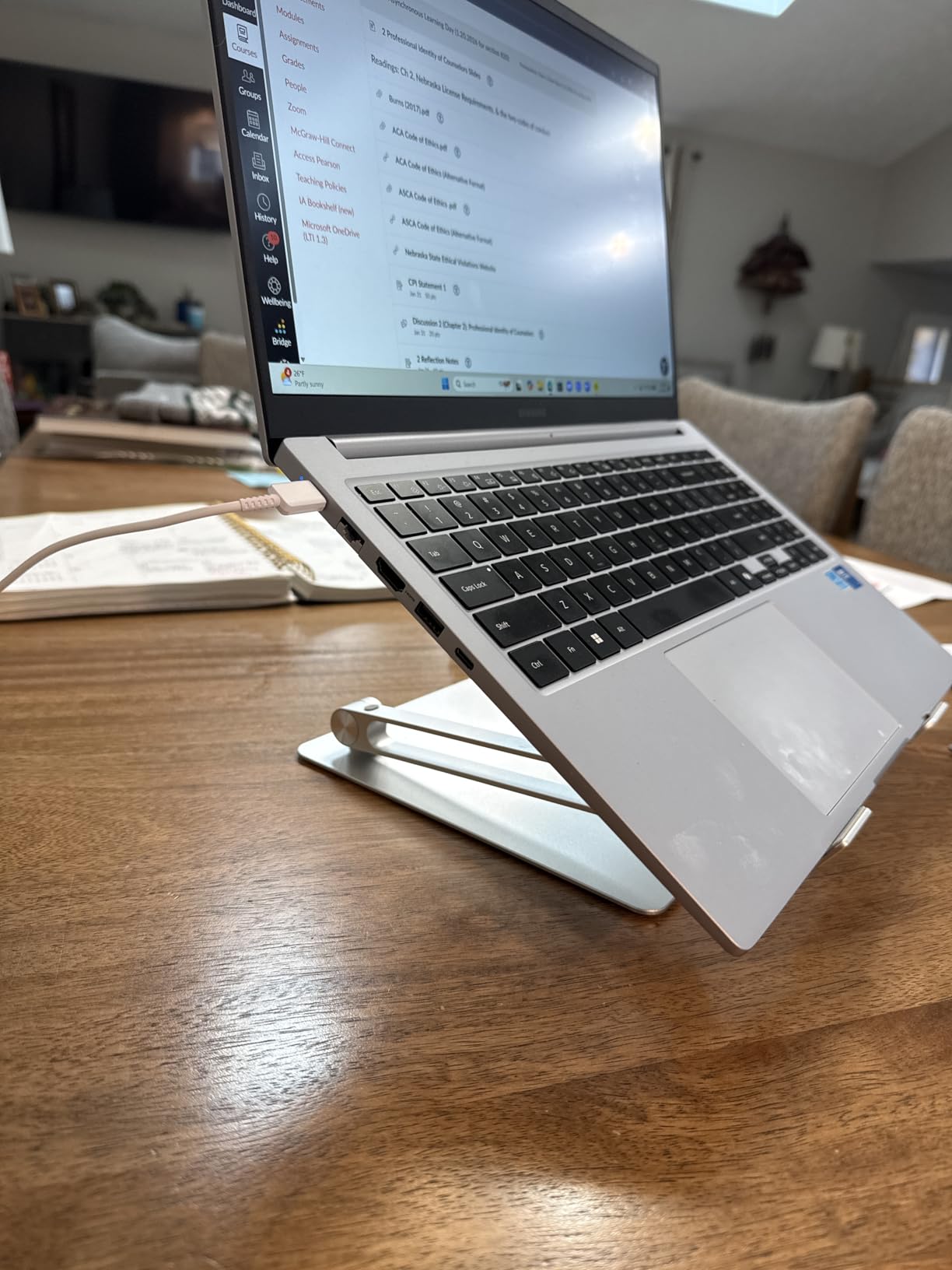 Customer setup showing Lamicall laptop stand on desk with MacBook