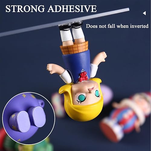 LMJIA clear mounting dot holding a small figure upside down to show adhesive strength