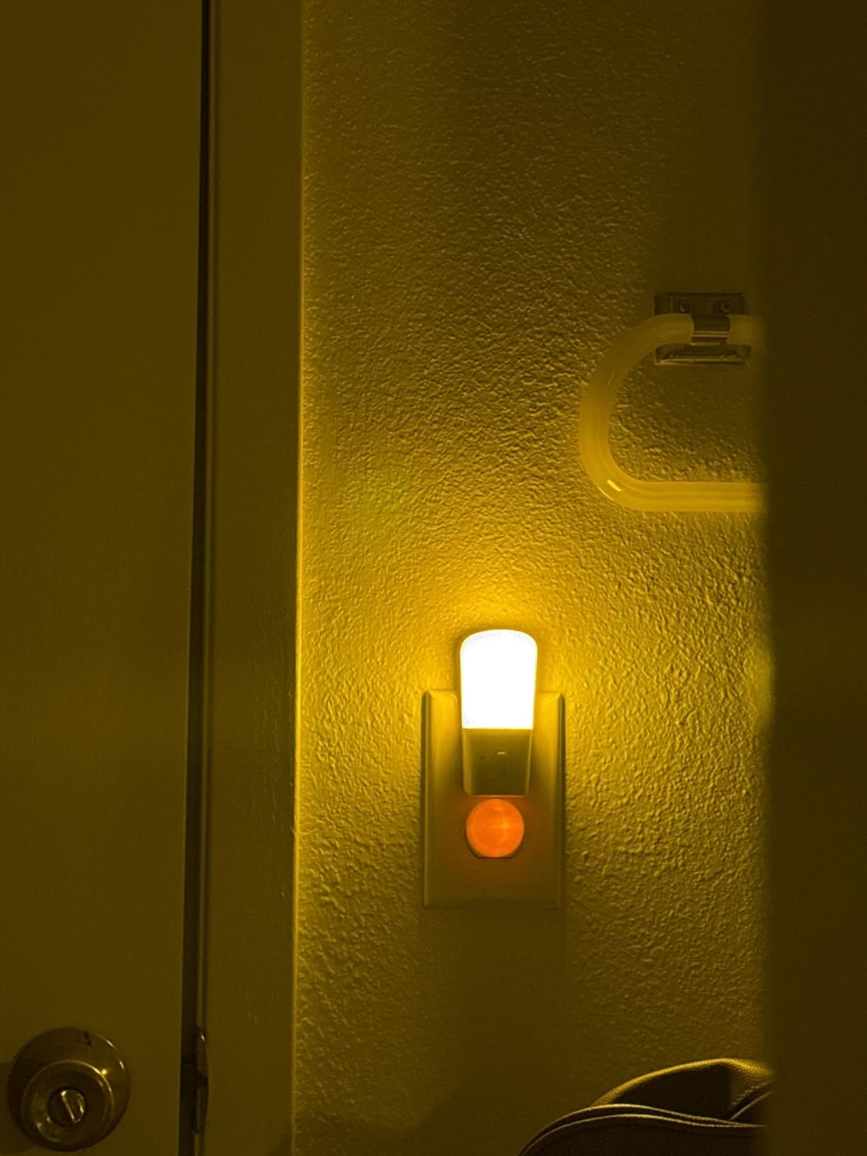 Customer photo showing LOHAS Red Night Light glowing in bathroom