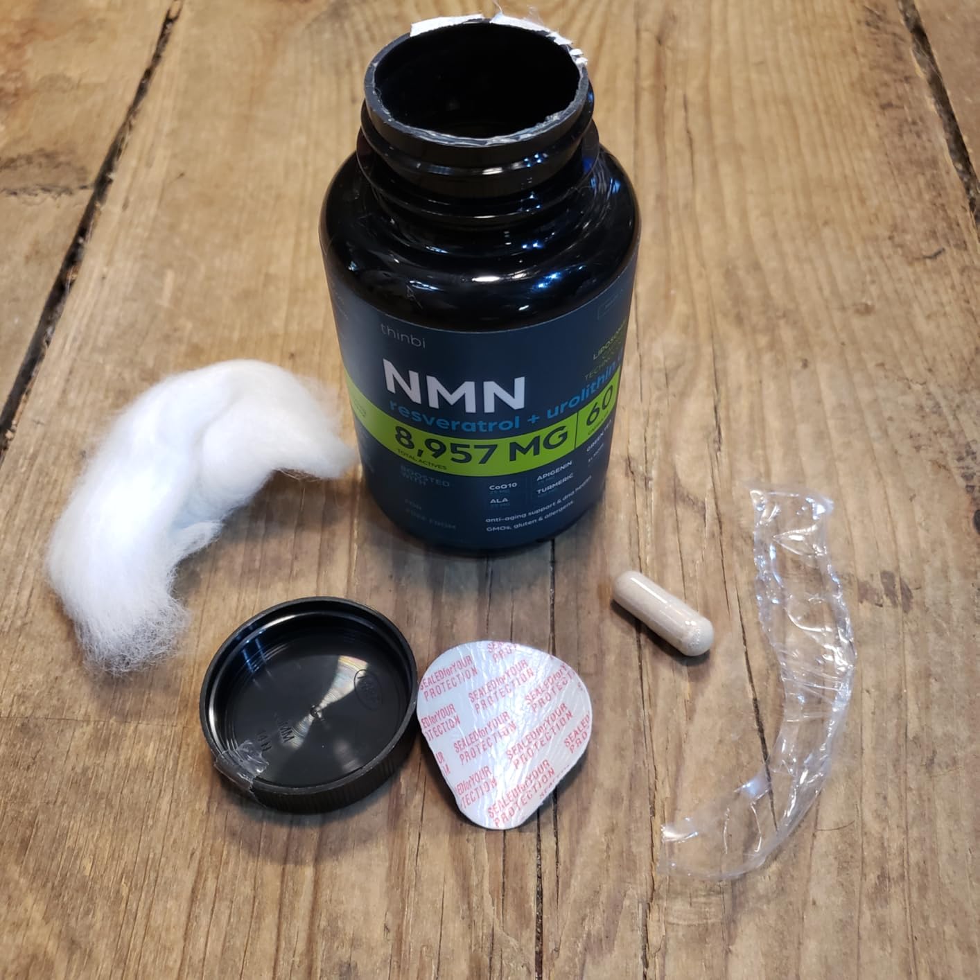 Thinbi NMN supplement bottle showing the 8957mg formula label