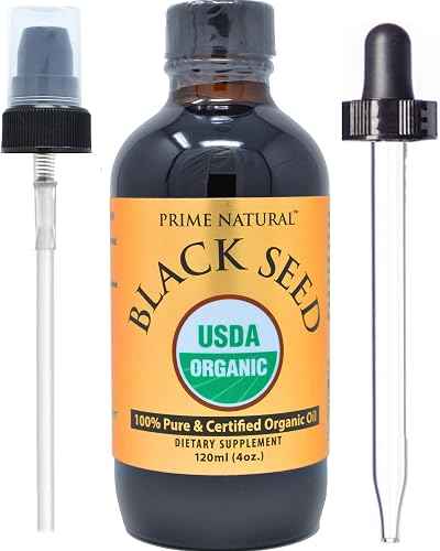 Pouring the dark black seed oil to show its thin, olive-oil-like consistency