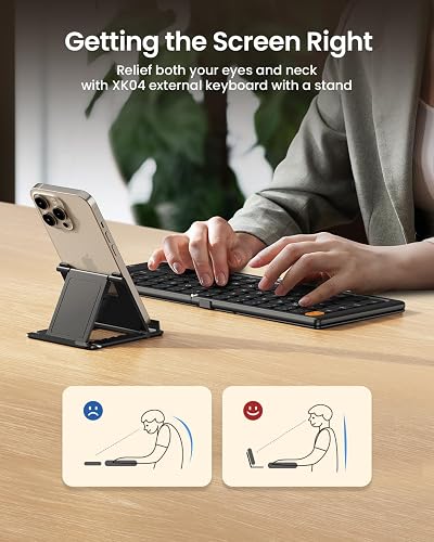 The ProtoArc XK04 in use on a desk with a phone propped on the included stand