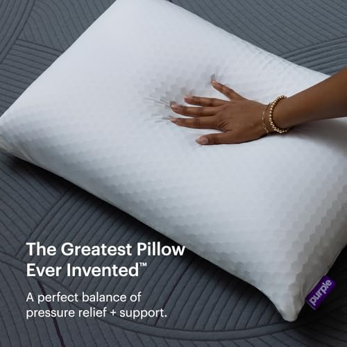 Hand pressing into Purple Harmony Pillow showing responsive support