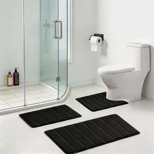 The Run Helix set's three black pieces arranged around a toilet, shower, and vanity