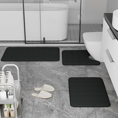 The large rug, small rug, and U-shaped toilet mat from the Run Helix set laid out on a bathroom floor