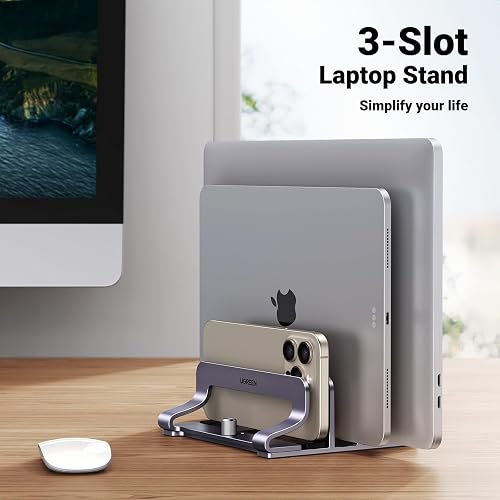 UGREEN 3-Slot Vertical Laptop Stand holding three graduated devices upright on a desk