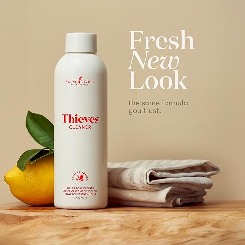 Young Living Thieves Household Cleaner concentrate bottle shown with a lemon and folded cloth